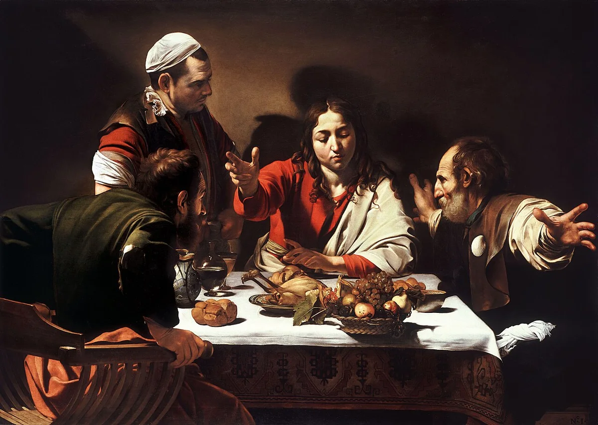 Pintura de Caravaggio com Jesus ressuscitado à mesa, com a mão erguida sobre o pão, e dois discípulos surpresos ao reconhecê-lo